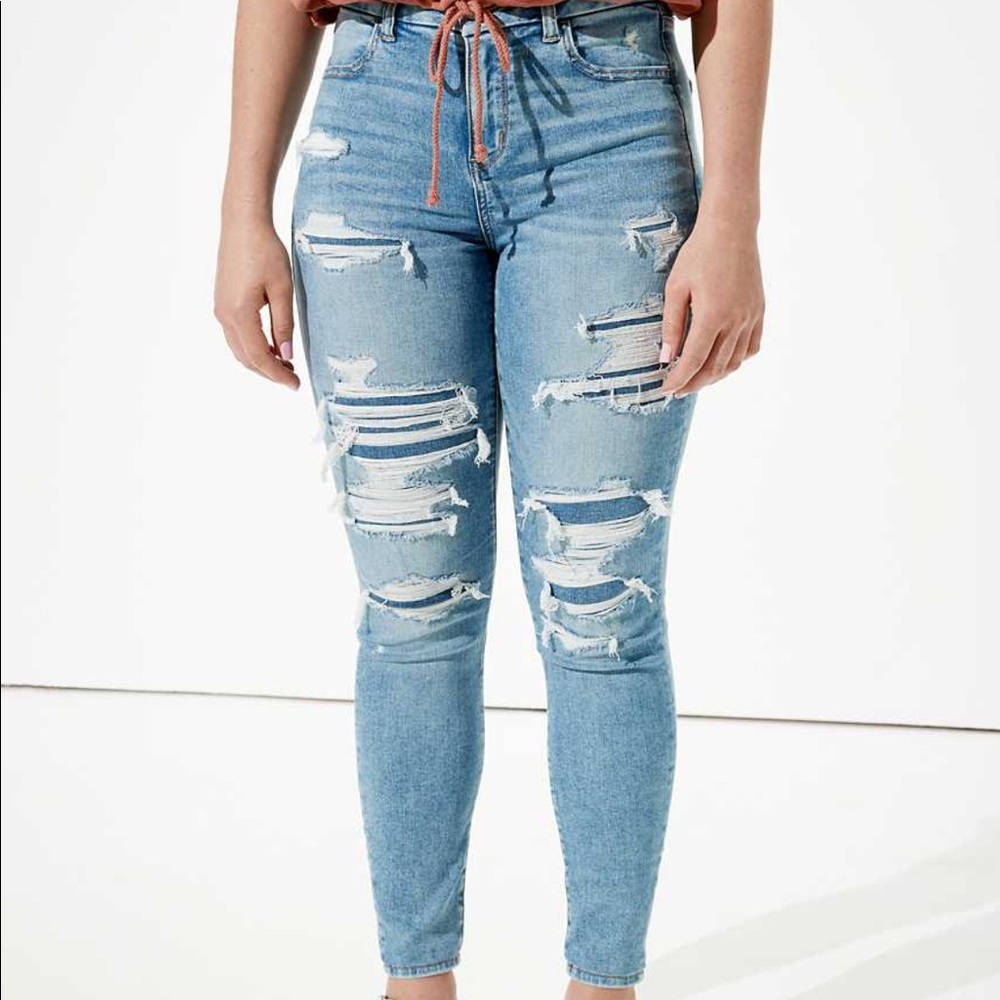 AE light wash and patched ripped jeans